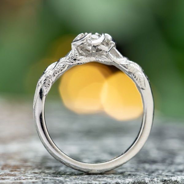 The diamond takes the stage as petals part to the side in this Nenya inspired ring that looks like a rose.