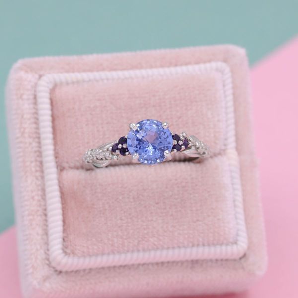 A light blue sapphire engagement ring.