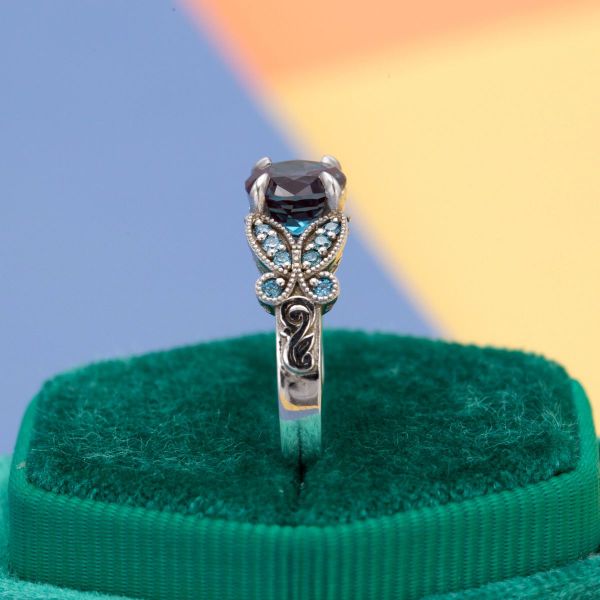 Alexandrite, blue diamond, and sapphire paint a rainbow of color in this butterfly engagement ring.
