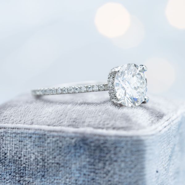 This ring's 2-carat lab diamond is truly the star of the show, set off by a delicate platinum setting and 72 pavé diamonds lining both the band and the basket setting. A ring like this might cost anywhere from $8,000 to $20,000 or more, depending on your diamond selection.