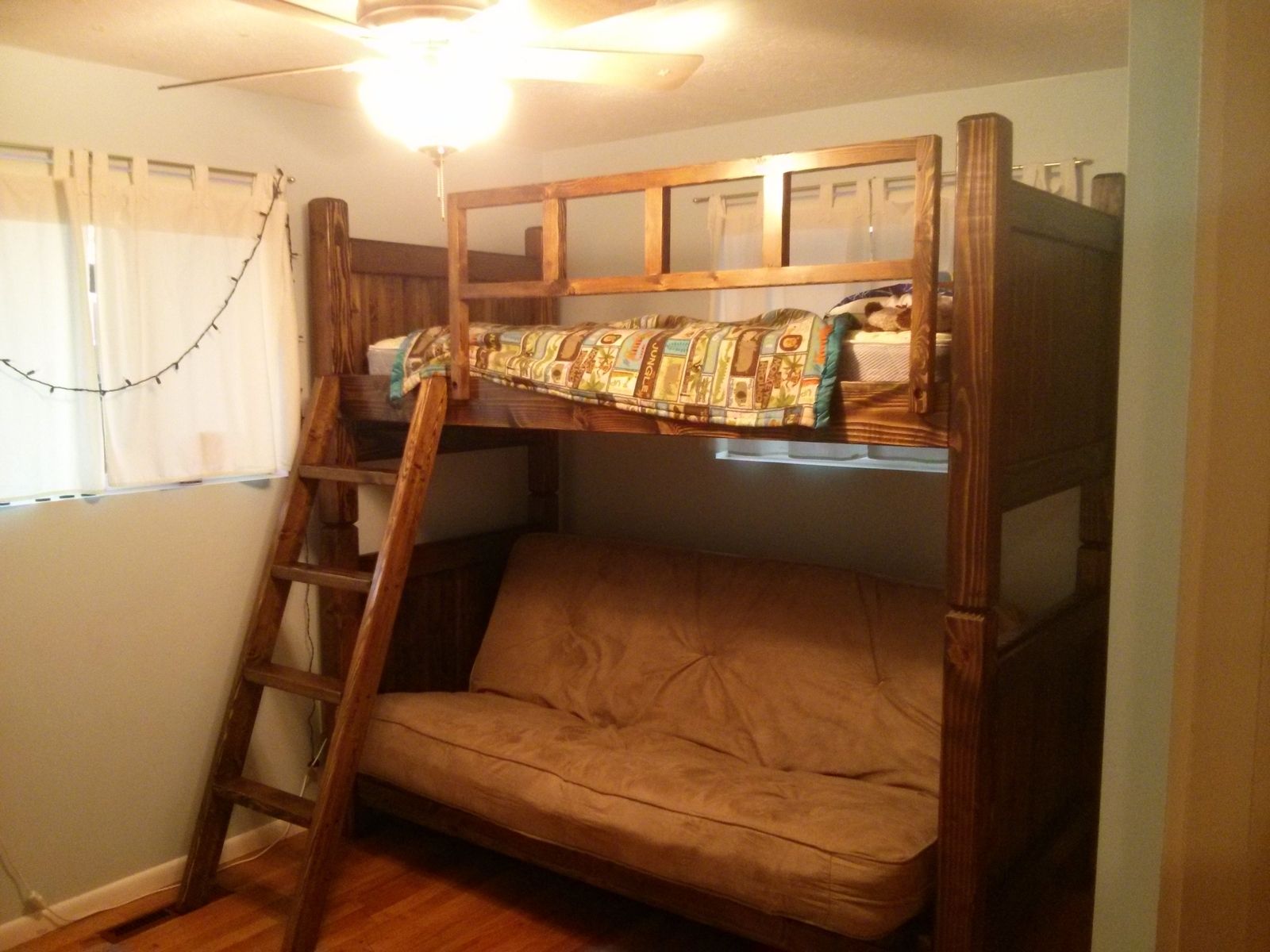 Full size loft store bed over futon