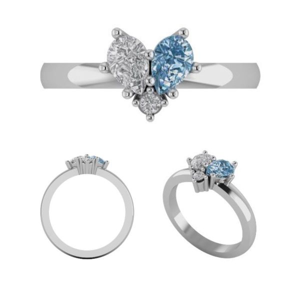 Two pear cut stones fit together to create one heart in this stunning moissanite and aquamarine engagement ring.