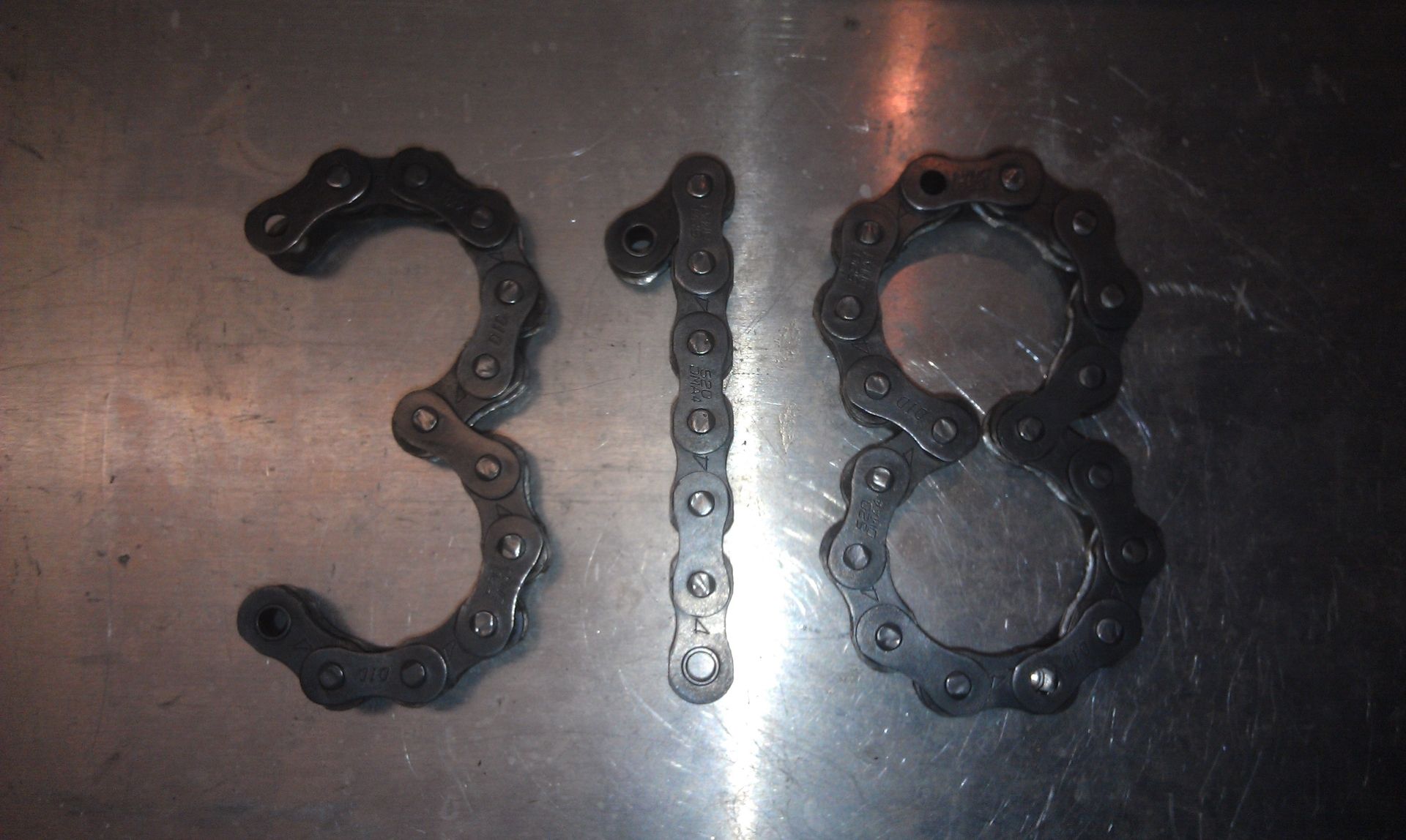 Hand Made Chain Numbers by Moto Metal Fab