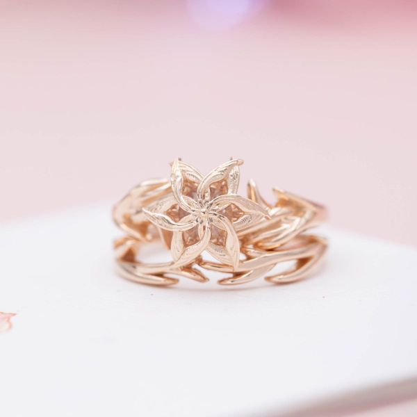 Warm rose gold and a laurel wreath-like design give this Nenya inspired bridal set a calming effect.