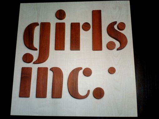 Custom Made Wood Girls Inc. Logo