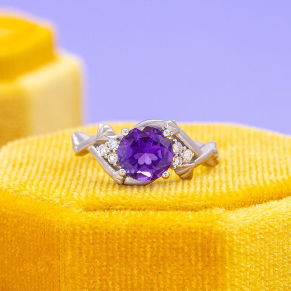 This amethyst engagement ring is set in white gold.