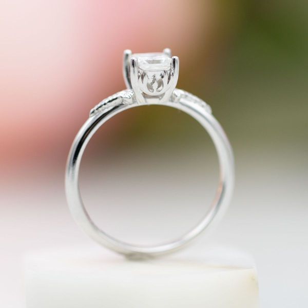 This classically styled white gold ring features a princess cut diamond center stone and a hidden Jedi Order inspired symbol.