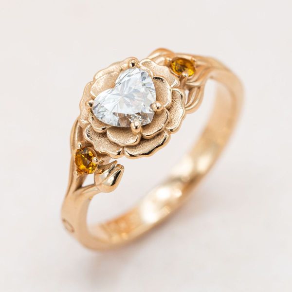Roses and tulips are mixed with diamond and citrine to create an engagement ring bouquet.