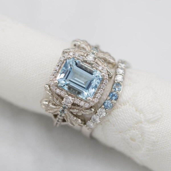 Dragonflies make up the sides of the band on this aquamarine center stone ring.