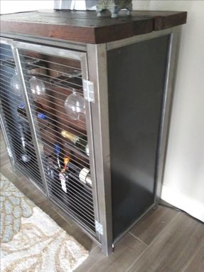 Custom Made Industrial Wine Storage With Hidden Cabinet