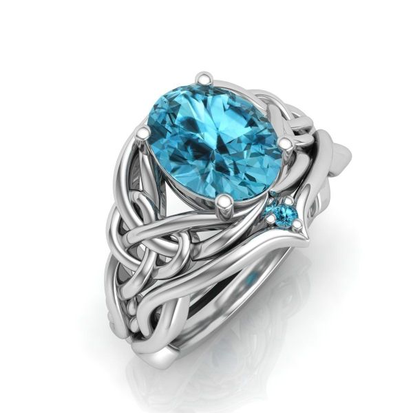 Triquetras hide in a tangle of lines and knots in this engagement ring.