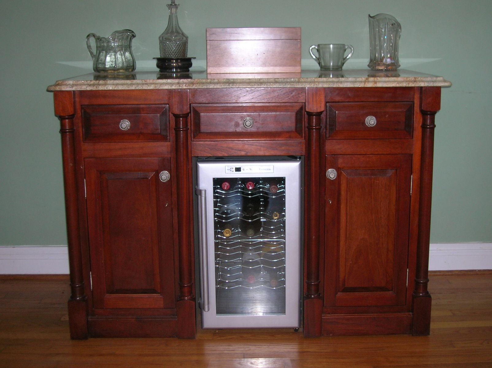 custom media cabinet made from white oak and walnut burl