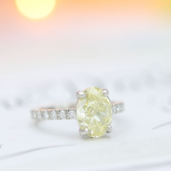 3.08 carats of fancy yellow diamond set in a timeless, pavé design.