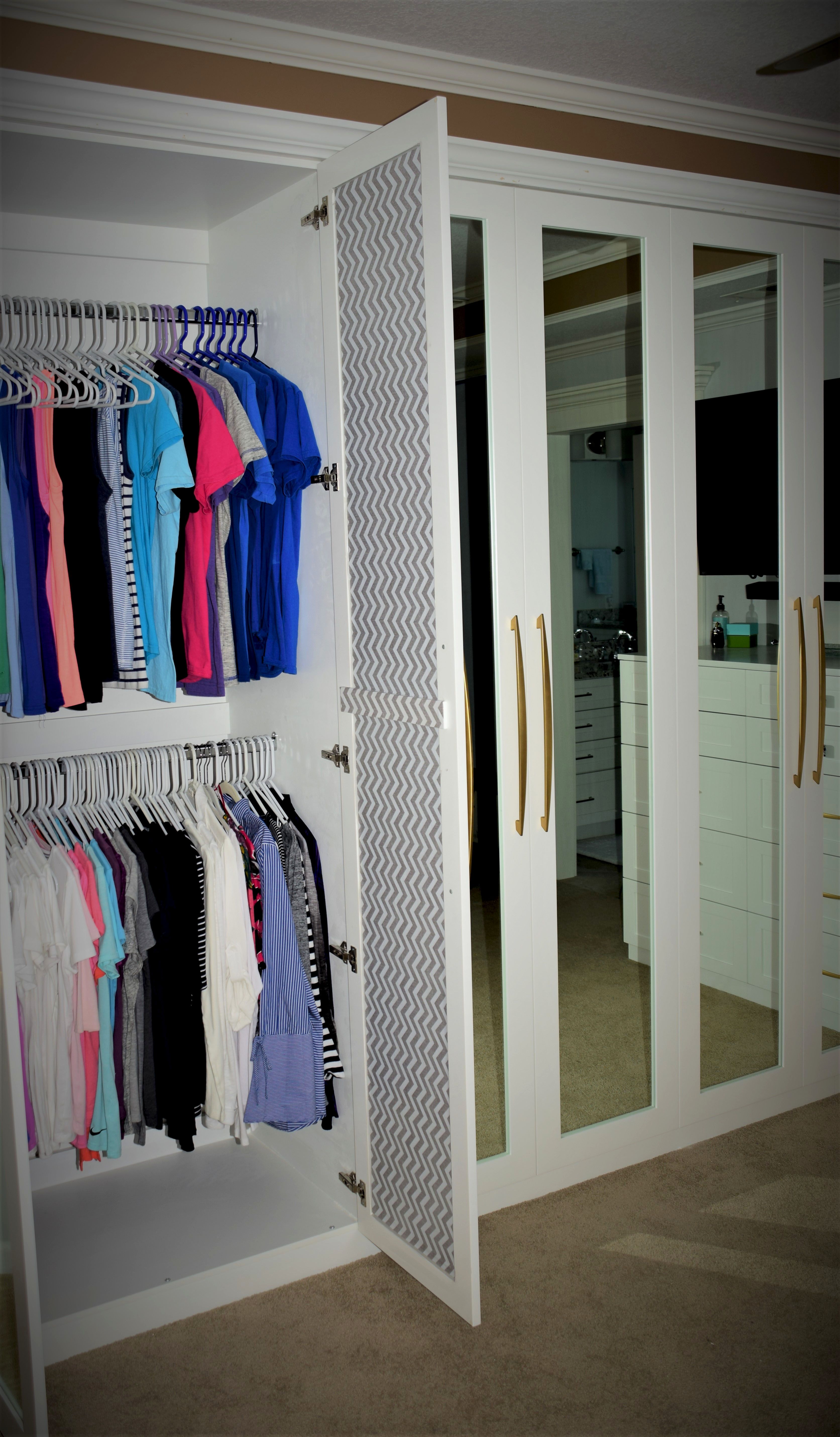 Custom White BuiltIn Closet Unit by Belak Woodworking LLC