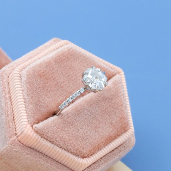 The hexagonal center moissanite is paired with moissanite accents.
