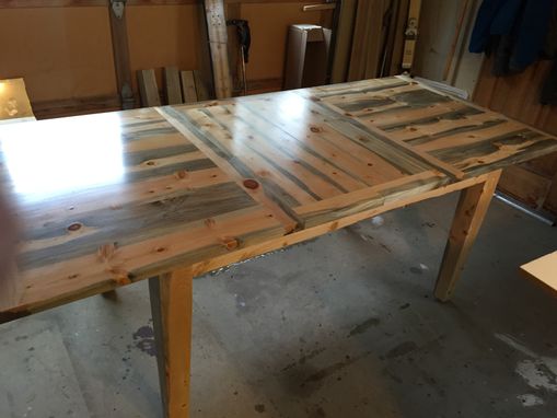Custom Made Beetle Kill Pine Dinin Room Table With Two Extension Leaves.