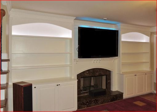 Custom Made Arched Top Bookshelves With Raised Panel Doors And Led Lighting