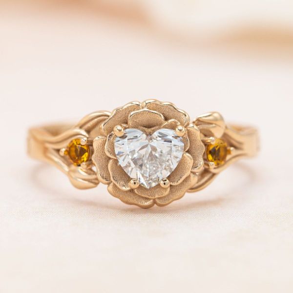 Roses and tulips are mixed with diamond and citrine to create an engagement ring bouquet.
