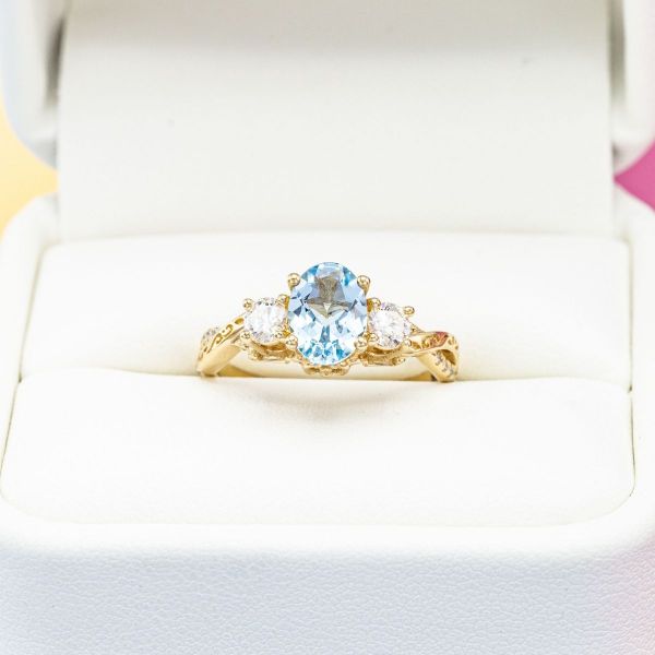 This bright sky blue aquamarine looks even bluer when paired with some side accent diamonds. 