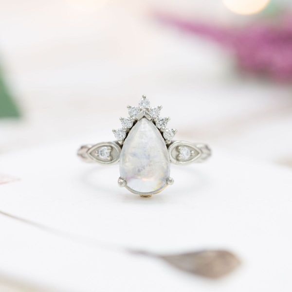 This stunning moonstone and diamond ring holds a golden secret.