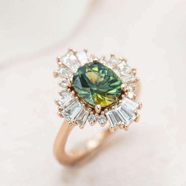 A gorgeous multi-colored sapphire in a ballerina halo. This stunning cushion cut sapphire reveals regions of yellows and greens (and a hint of blue).