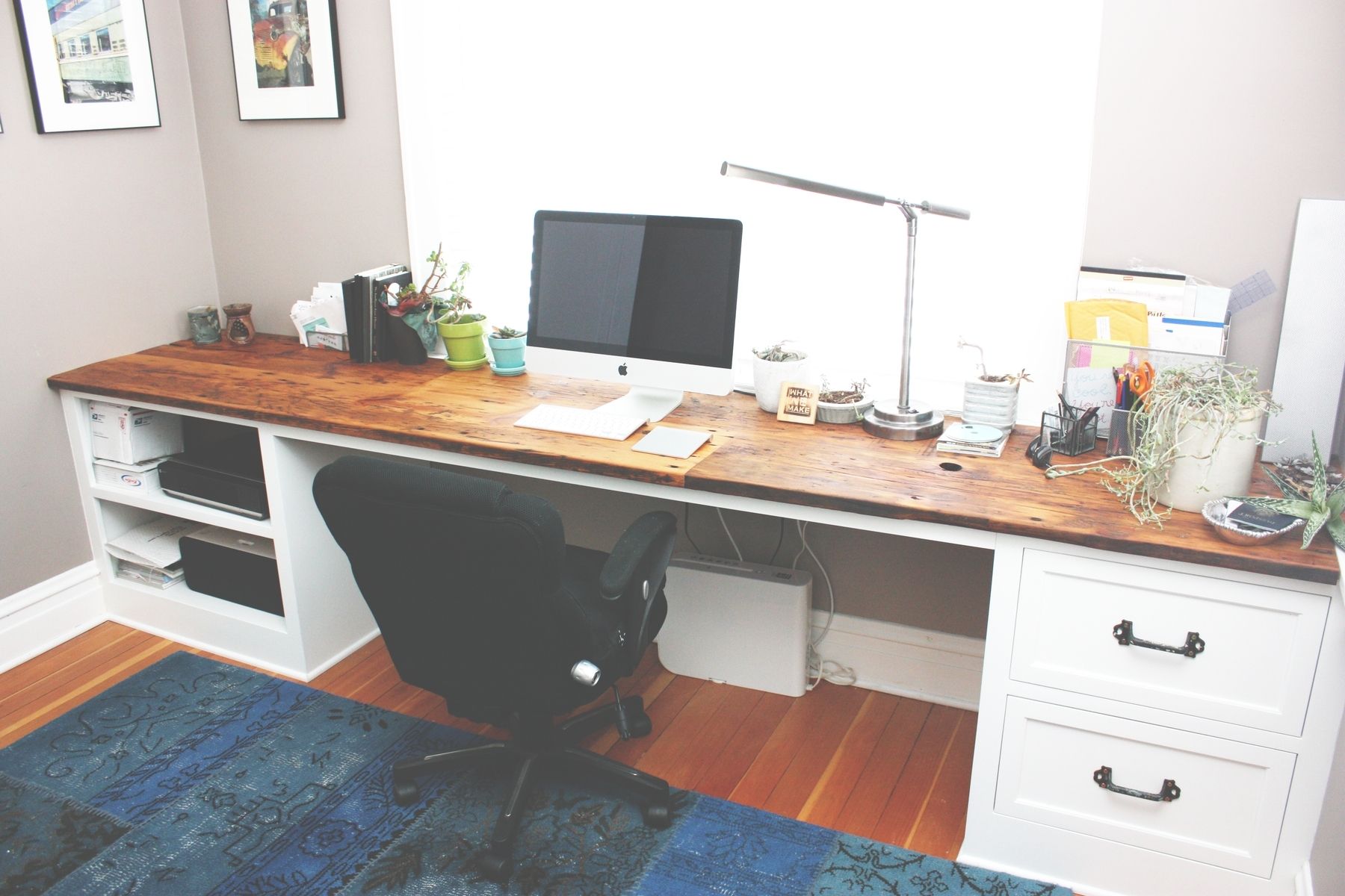 White desk with wooden top and desk cabinet