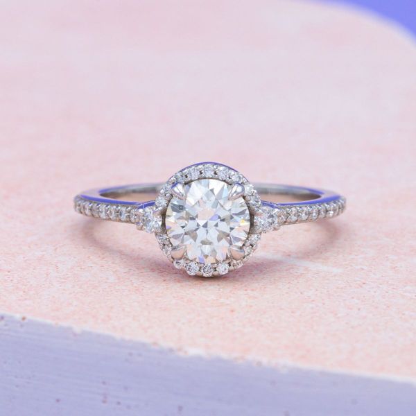 Dozens of lab-grown diamonds shimmer in this engagement ring that features a hidden Rebel Alliance inspired symbol.