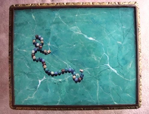 Custom Made Trompe L'Oeil Bead Necklace Painted On Faux Marble Table Surface.
