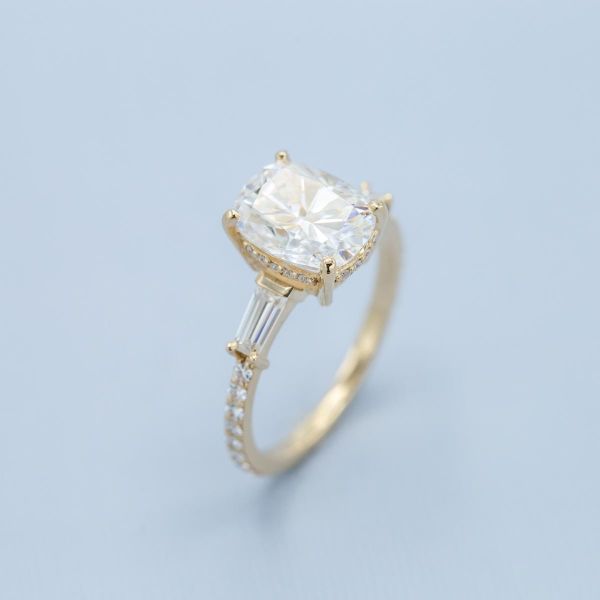 This moissanite ring boasts a hidden halo and side accent stones for all the bling!