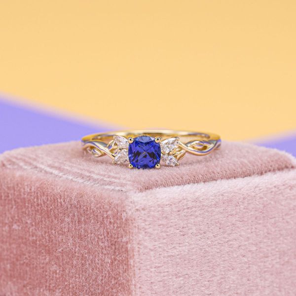 Dark blue lab sapphire engagement ring.