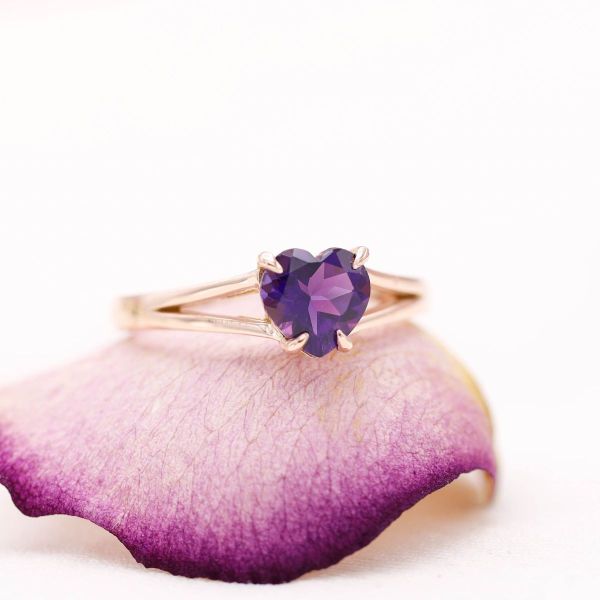 We’re over the moon for this heart cut amethyst centered engagement ring hiding the constellations of our star-crossed couple.
