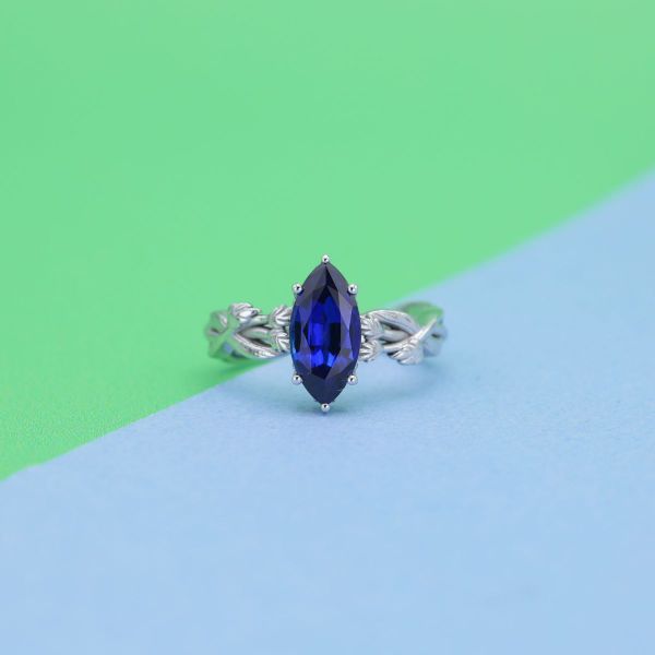 A blue sapphire in a marquise cut with white gold band.
