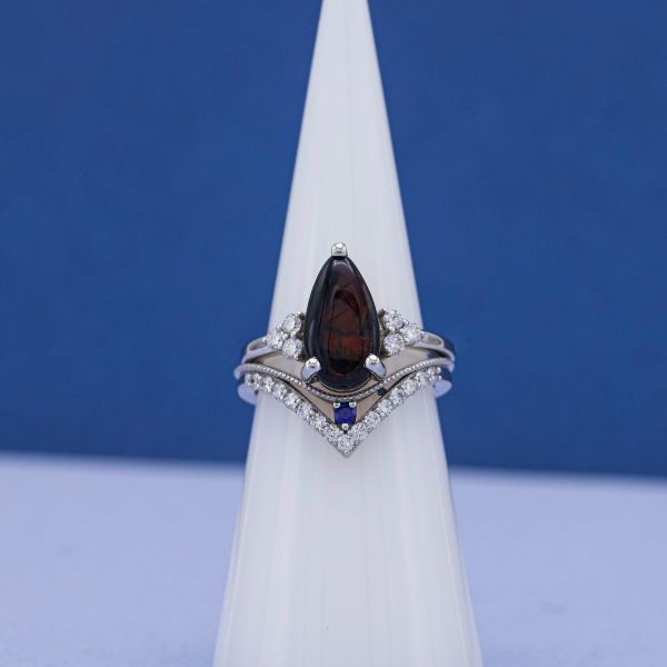 A black opal has a similar take on the dark aesthetic of salt and pepper diamonds.