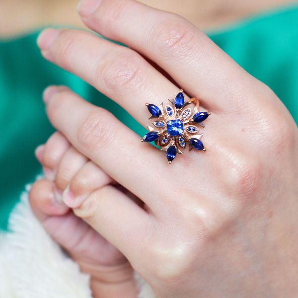 A husband's gift to his wife to celebrate the birth of their first daughter. We designed this sapphire snowflake ring in honor of the baby's September birthstone.