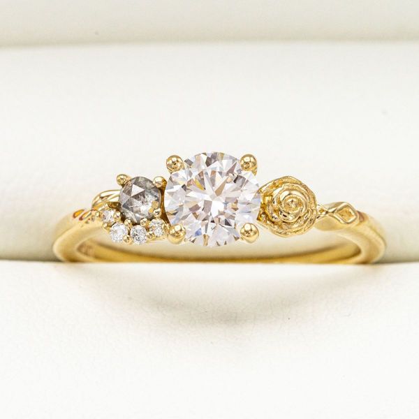 The rose in this diamond engagement ring symbolizes her calm nature.
