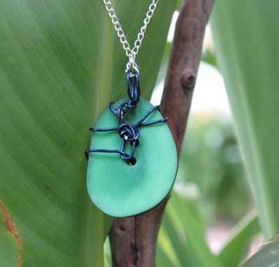 Custom Made Necklace: Blue Spirals On A Green Tagua Nut Slice
