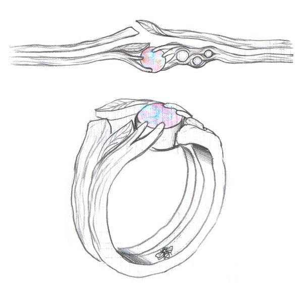 The opals and diamonds grow out of a branch-like band in this tree inspired engagement ring.