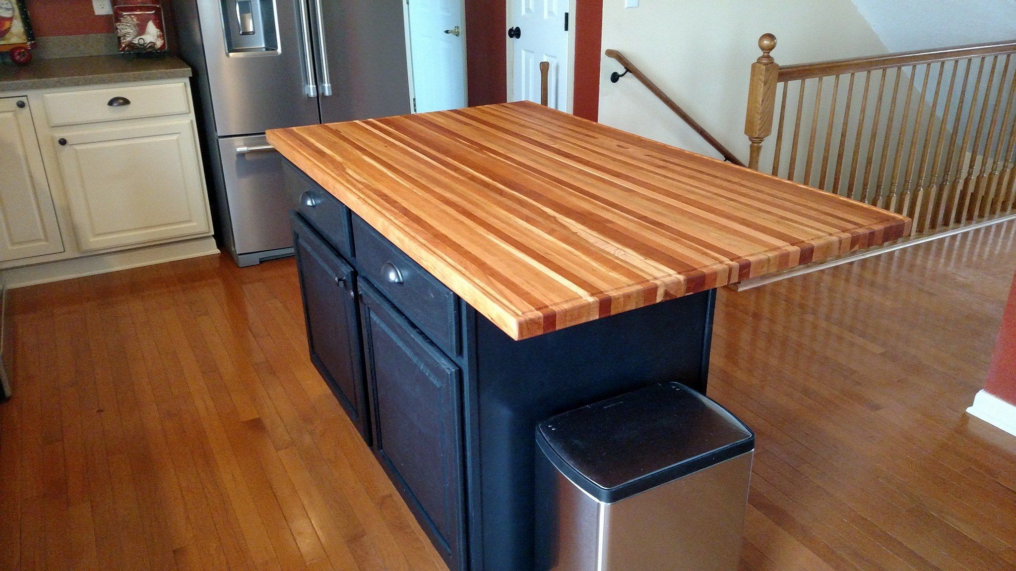 Grey cabinets with butcher block countertops