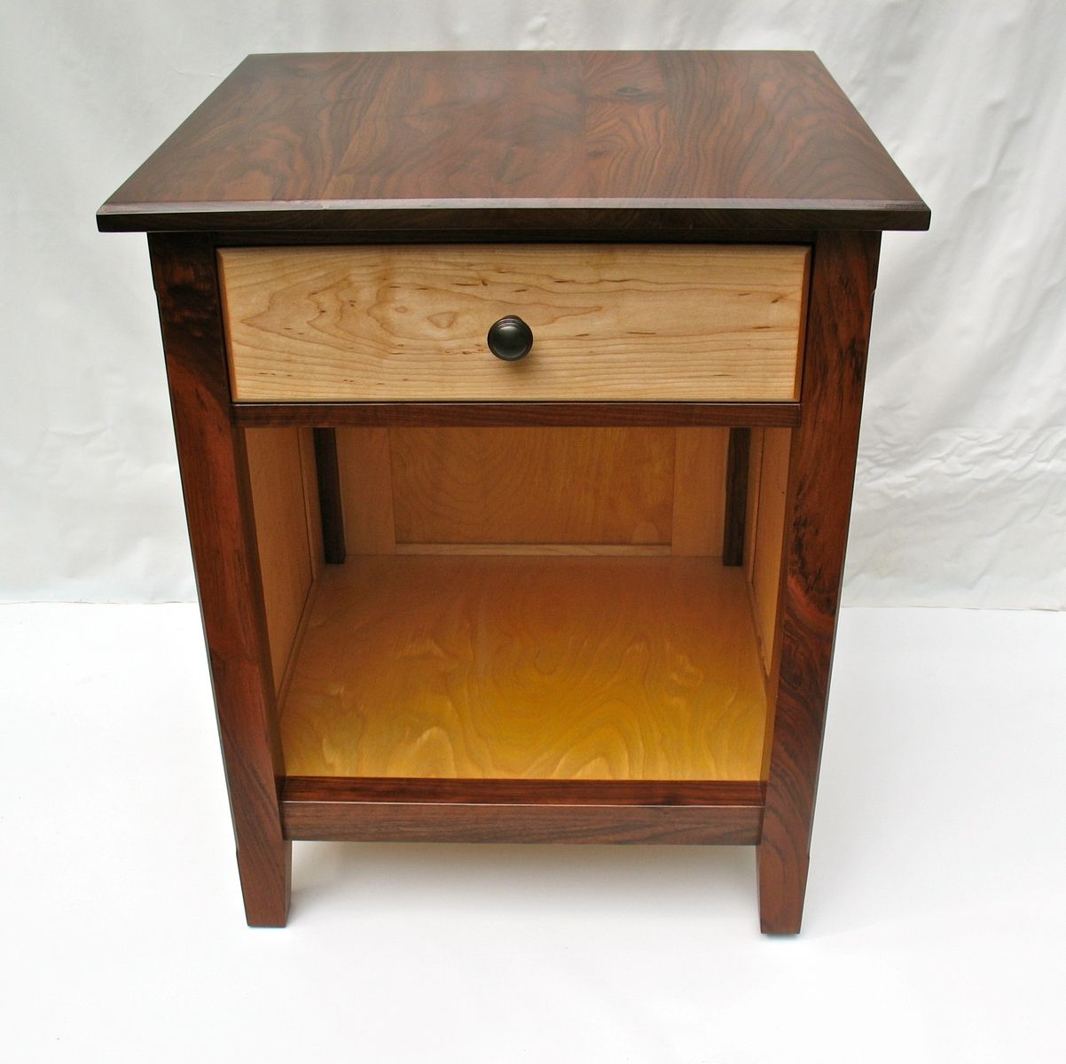 Hand Crafted Black Walnut And Maple Nightstand With Raised Panels by