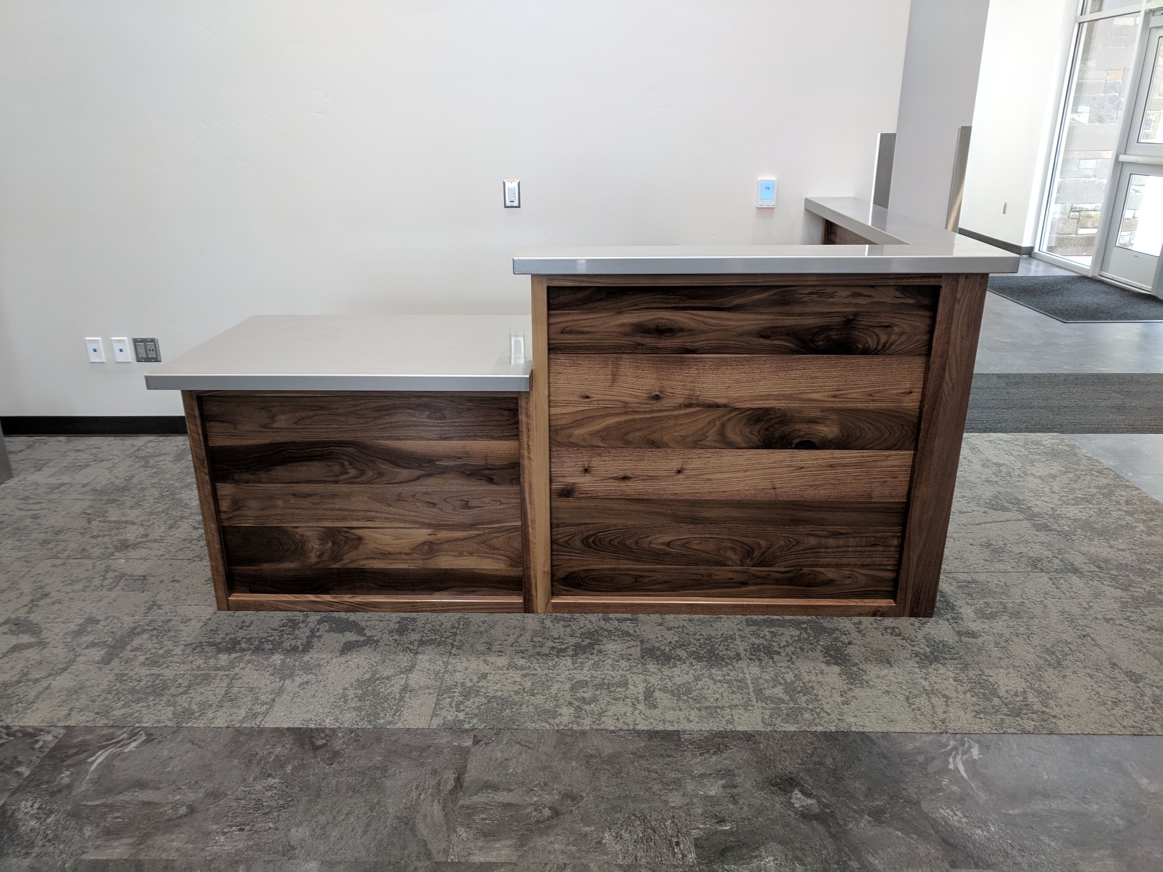 Hand Made Custom Reception Desk From Walnut And Stainless Steel by re