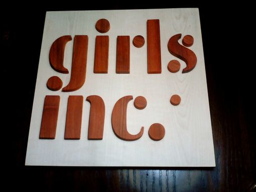 Custom Made Wood Girls Inc. Logo