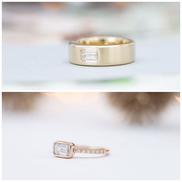 Both of these rings feature an emerald-cut diamond in an east-west (horizontal) setting of 14K gold. The yellow gold ring on top cost about $700 more than the rose gold ring on the bottom, because its very wide band required significantly more gold to create.