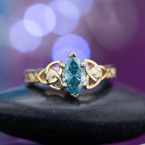 Fancy colored diamonds, like this vivid blue marquise cut diamond, make for a rare and beautiful center stone.