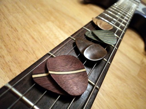 Custom Made Wooden Guitar Picks With Hand-Shaped Thumb Grip