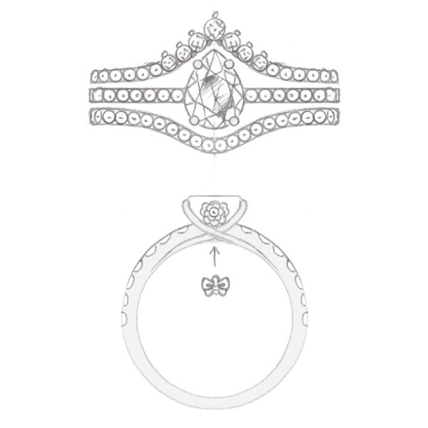 The aim of the game was bling for this pear cut diamond bridal set, and multiple channel-set diamond bands won the day.