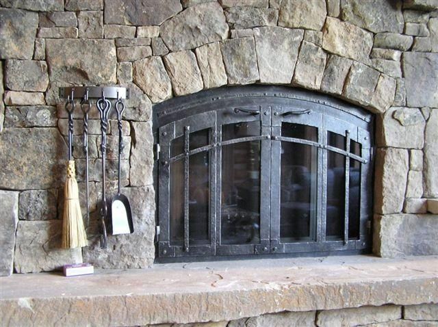 Handmade Custom Fireplace Screen With Bifold Doors by Ironhaus