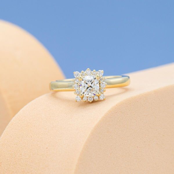 Last one! A natural diamond sits in the center of this engagement ring.