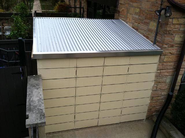 hand made custom shed made of cement board and stainless