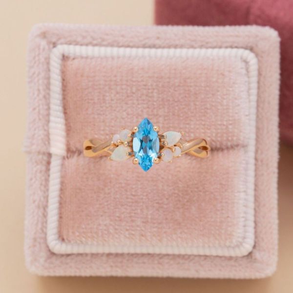 We could swim all day in the blue topaz of this mermaid inspired engagement ring