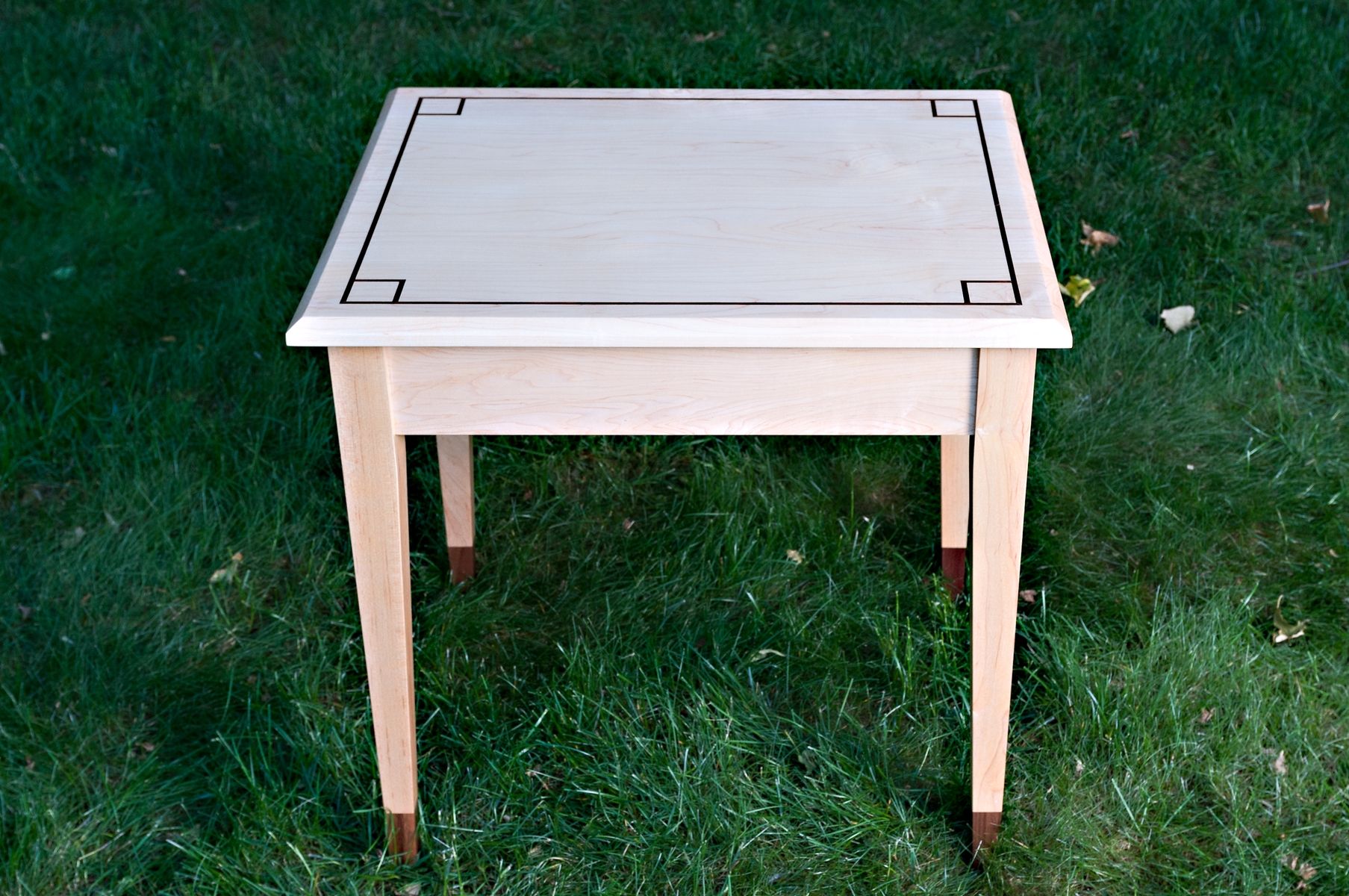 Hand Made End Table With Contrasting Feet And Inlay by Glessboards